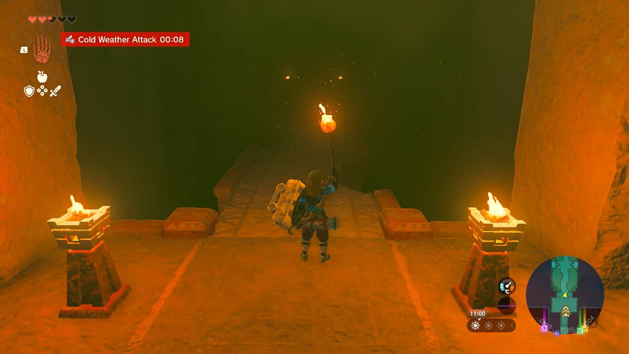 Tears of the Kingdom Lightning Temple walkthrough: Link approaching a bridge in a dark room with a torch. Two lit braziers sit either side of him.