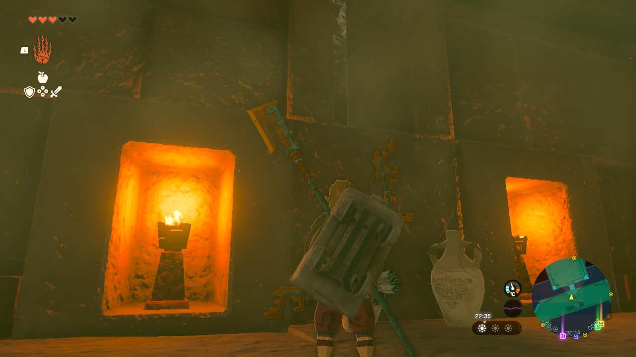 Tears of the Kingdom Lightning Temple walkthrough: Link looking at a hole in the wall, in-between two lit braziers.