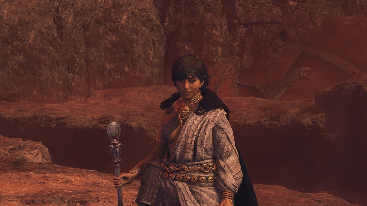 Dragon's Dogma 2 best staff: A player stands in front of a dragon in the game, wielding a staff. Image captured by VideoGamer.
