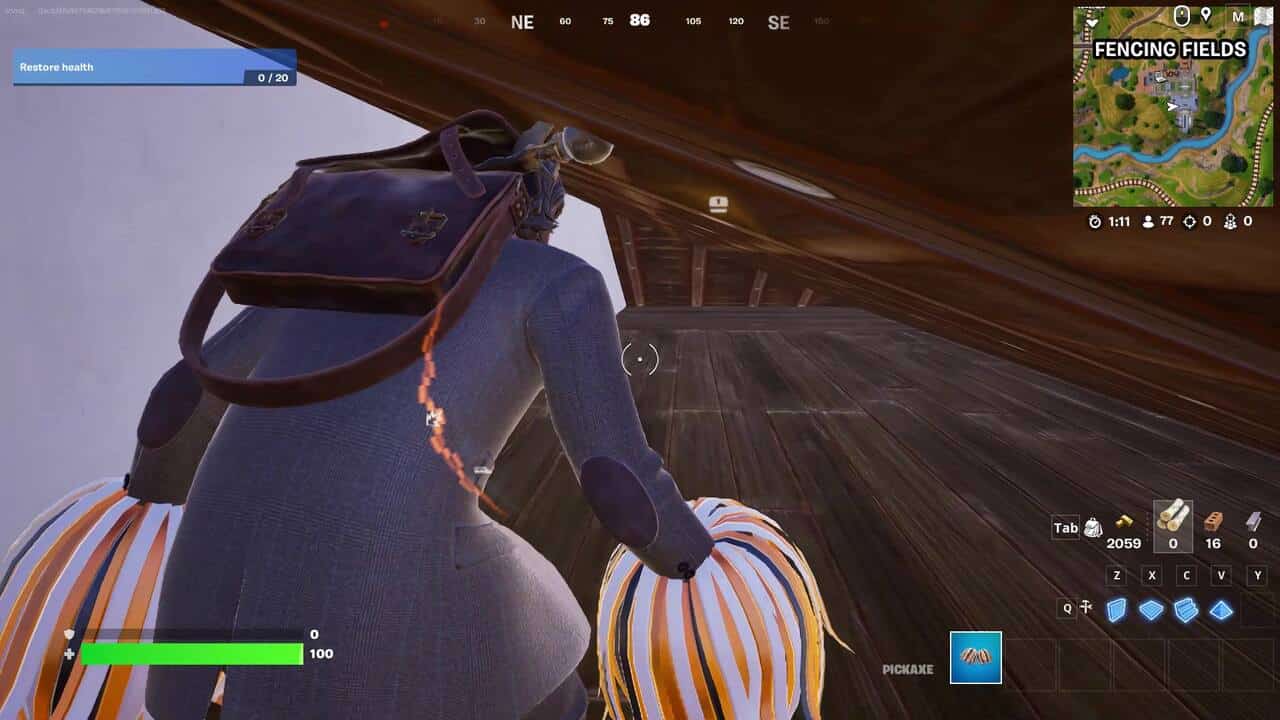 Fortnite best hiding spots: A player crawling through a small crawlspace in Fortnite.