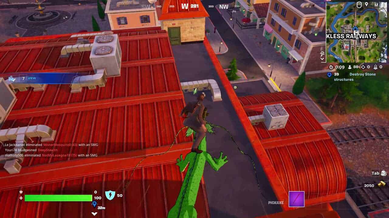 Fortnite best hiding spots: A player gliding on a dragon towards the roof of the Reckless Railways station in Fortnite.