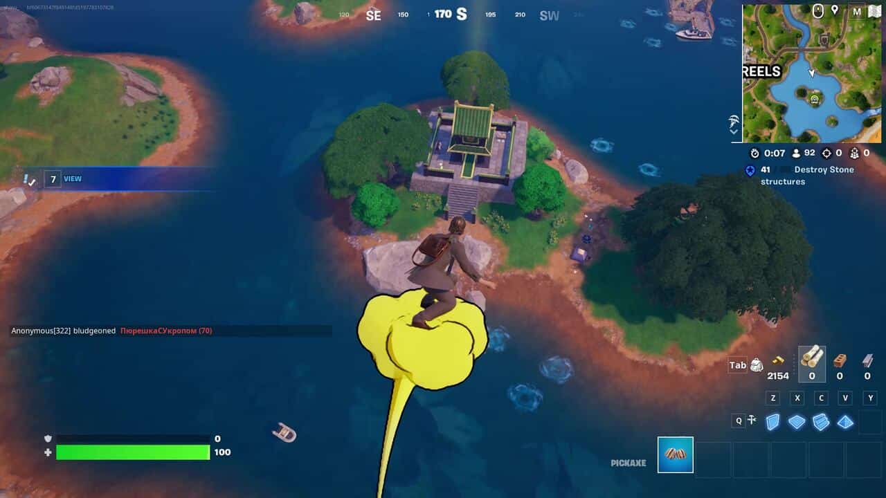 Fortnite best hiding spots: A player on a yellow cloud gliding towards a green shrine on an island in Fortnite.