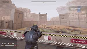 In the video game, Helldivers 2, a man is standing in front of a building, illuminating the classic enemy's whereabouts as he explores.