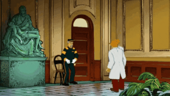 A man in a white coat, the Broken Sword: Reforged lead, speaking to a uniformed guard next to a statue and plants in an elegant hallway.