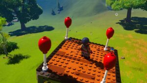 A player uses balloons on their dynamic foundation to fly in LEGO Fortnite. Image captured by VideoGamer.