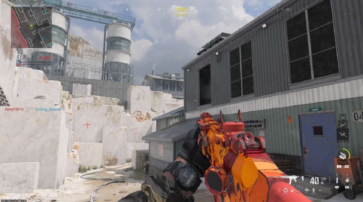 A screenshot of MW3 with a gun in the background.