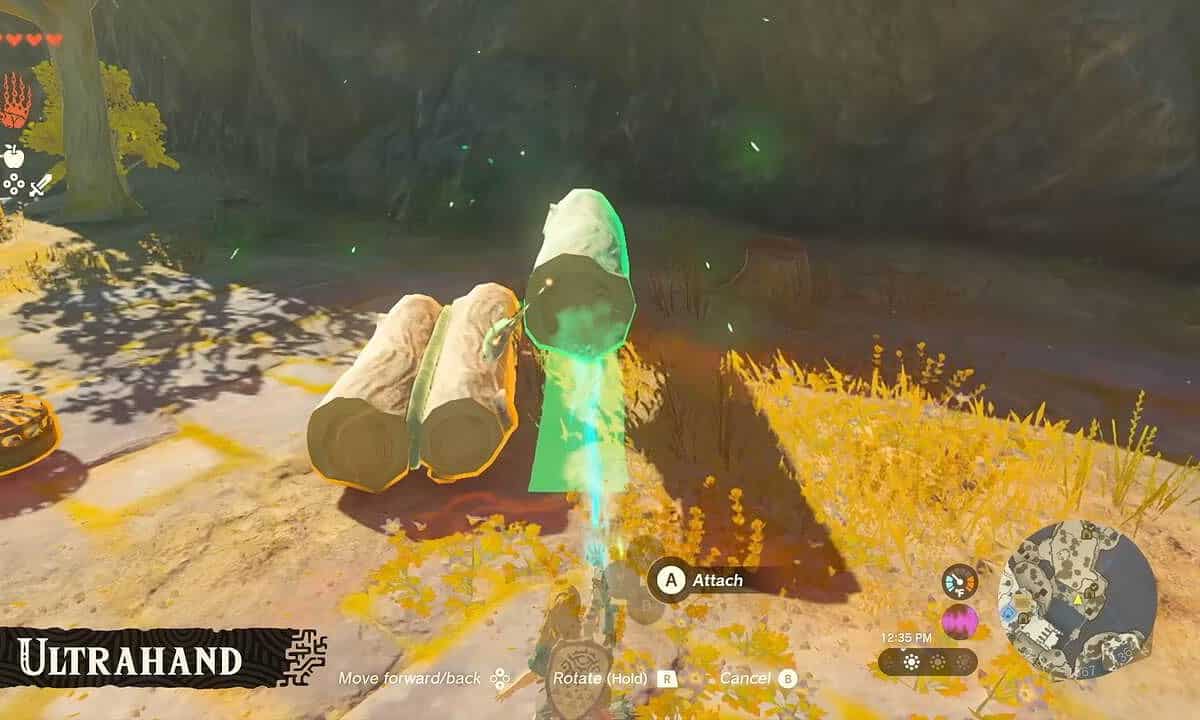 Tears of the Kingdom Ultrahand: Link using Ultrahand to attach a set of three logs together.
